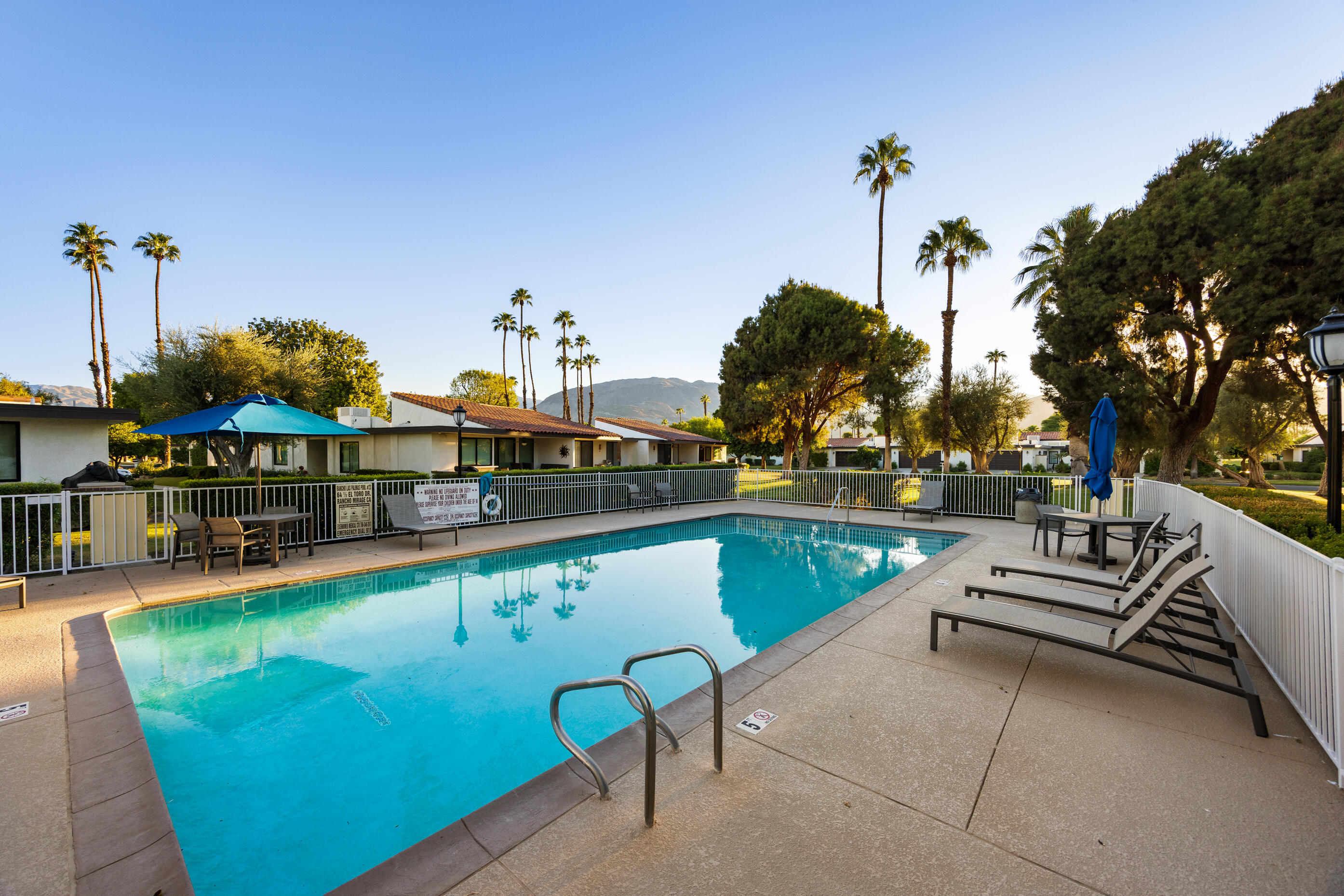 60 El Toro Drive Rancho Mirage, CA 92270 - Photo 33 of 38 a swimming pool with outdoor seating and yard