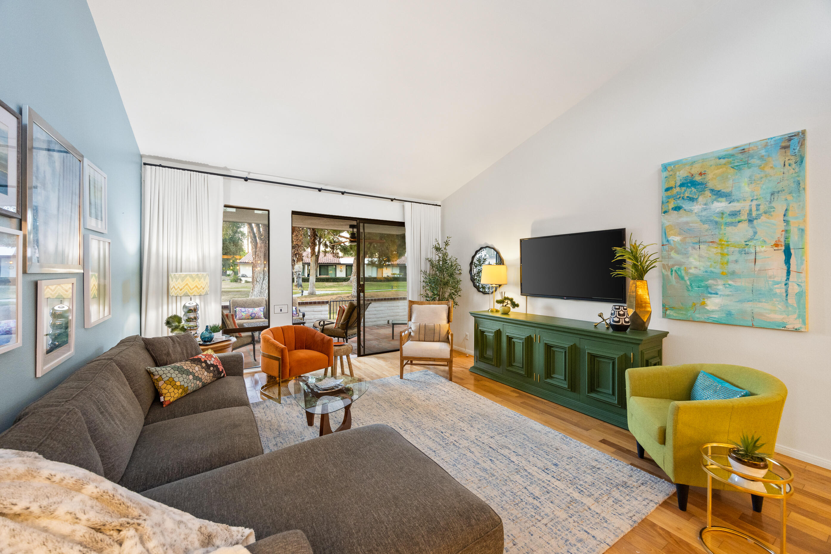 60 El Toro Drive Rancho Mirage, CA 92270 - Photo 4 of 38 a living room with furniture and a flat screen tv