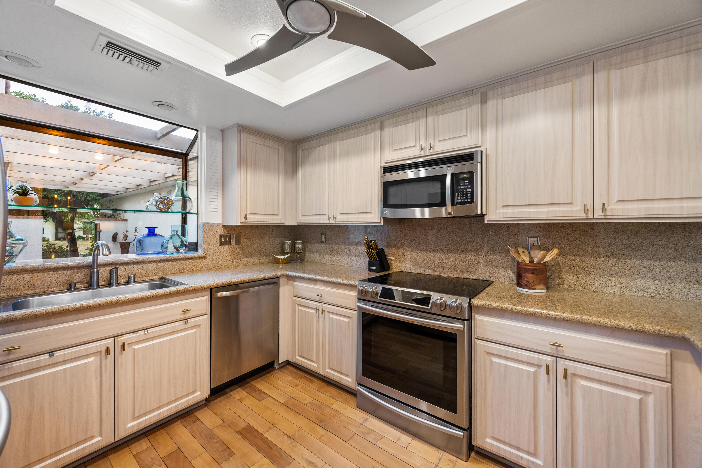 60 El Toro Drive Rancho Mirage, CA 92270 - Photo 8 of 38 a kitchen with granite countertop cabinets stainless steel appliances and a counter space