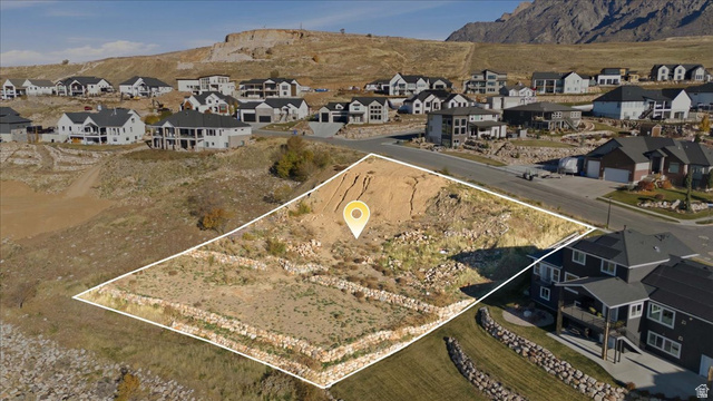 1211 West Fallow Way Ogden, UT 84414 - Photo 1 of 20 Aerial view of property's location with nearby suburban area and a mountainous background