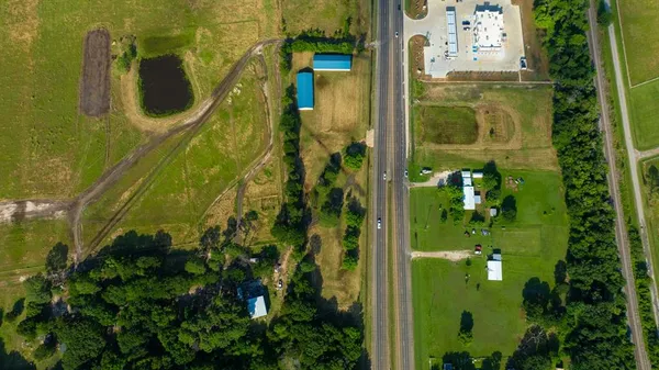 an aerial view of a residential apartment building with a yard