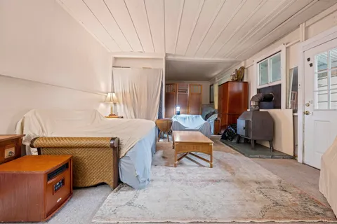 a room with furniture a washer and dryer