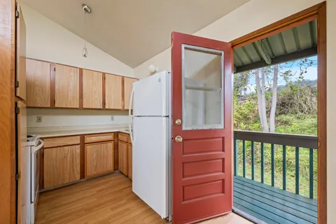 a view of a kitchen from the hallway