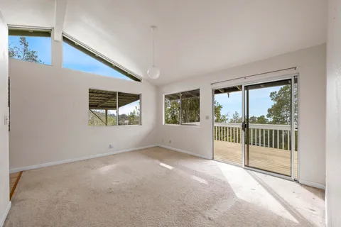a view of an empty room with windows