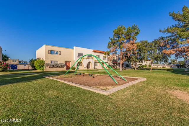a view of a playground with basketball court