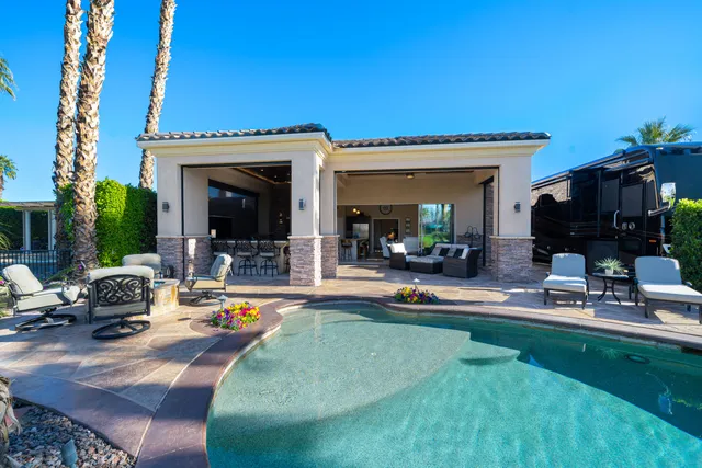 a outdoor space with a couch and chairs