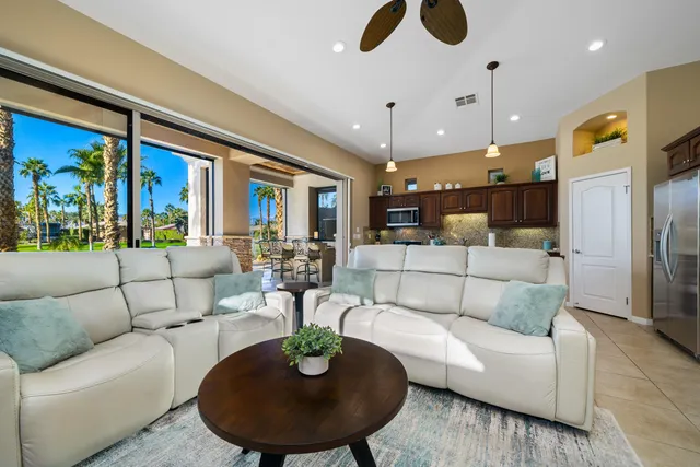 a bedroom with a bed and a mirror