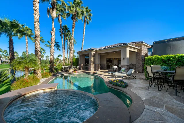 a view of a backyard with sitting area and furniture