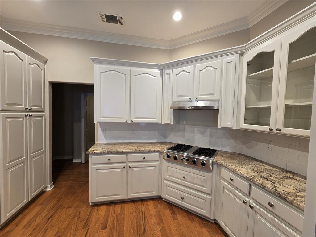 10407 Bethany State Line Road Bethany, LA 71007 - Photo 12 of 30 a kitchen with granite countertop white cabinets and appliances