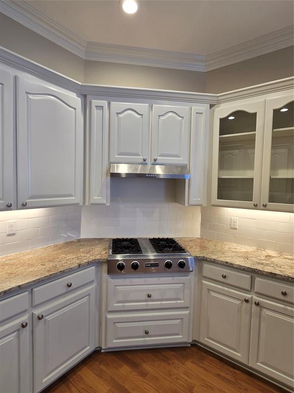 10407 Bethany State Line Road Bethany, LA 71007 - Photo 13 of 30 a kitchen with granite countertop white cabinets and white appliances