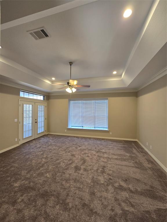 10407 Bethany State Line Road Bethany, LA 71007 - Photo 16 of 30 a view of an empty room with window and chandelier fan