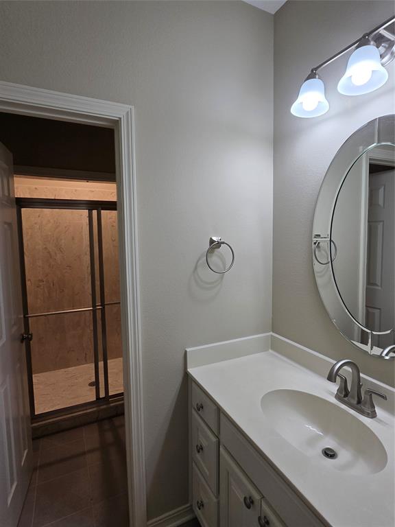 10407 Bethany State Line Road Bethany, LA 71007 - Photo 17 of 19 a bathroom with a sink and a mirror