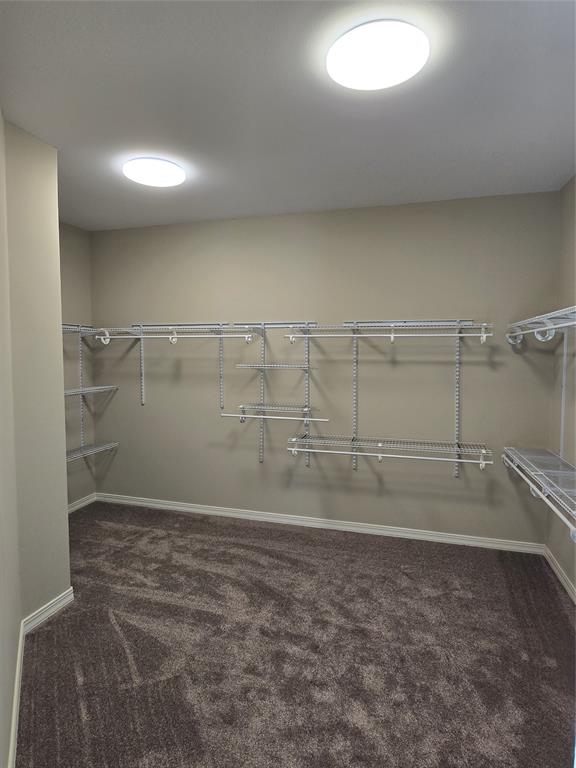 10407 Bethany State Line Road Bethany, LA 71007 - Photo 22 of 30 a view of a room with racks on the wall