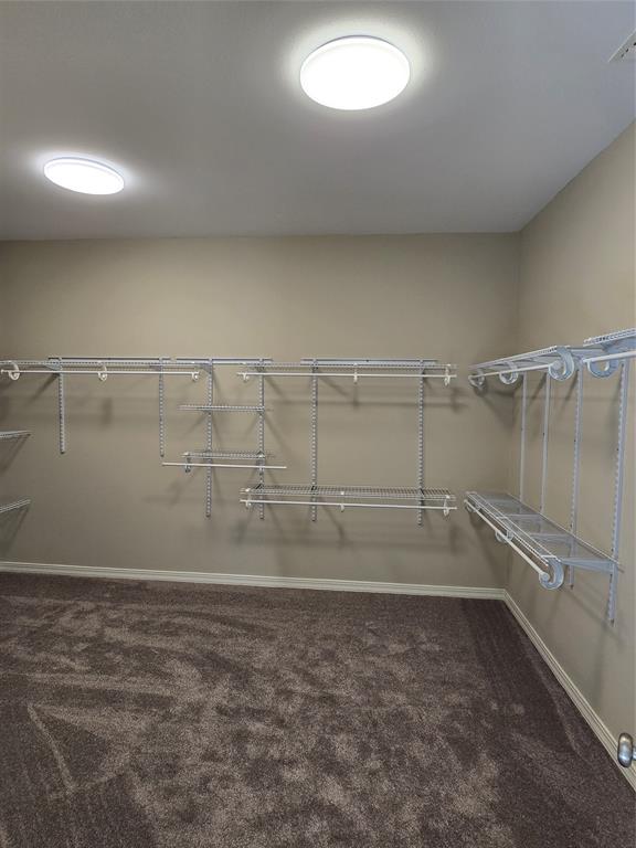 10407 Bethany State Line Road Bethany, LA 71007 - Photo 23 of 30 a view of a room with racks on the wall