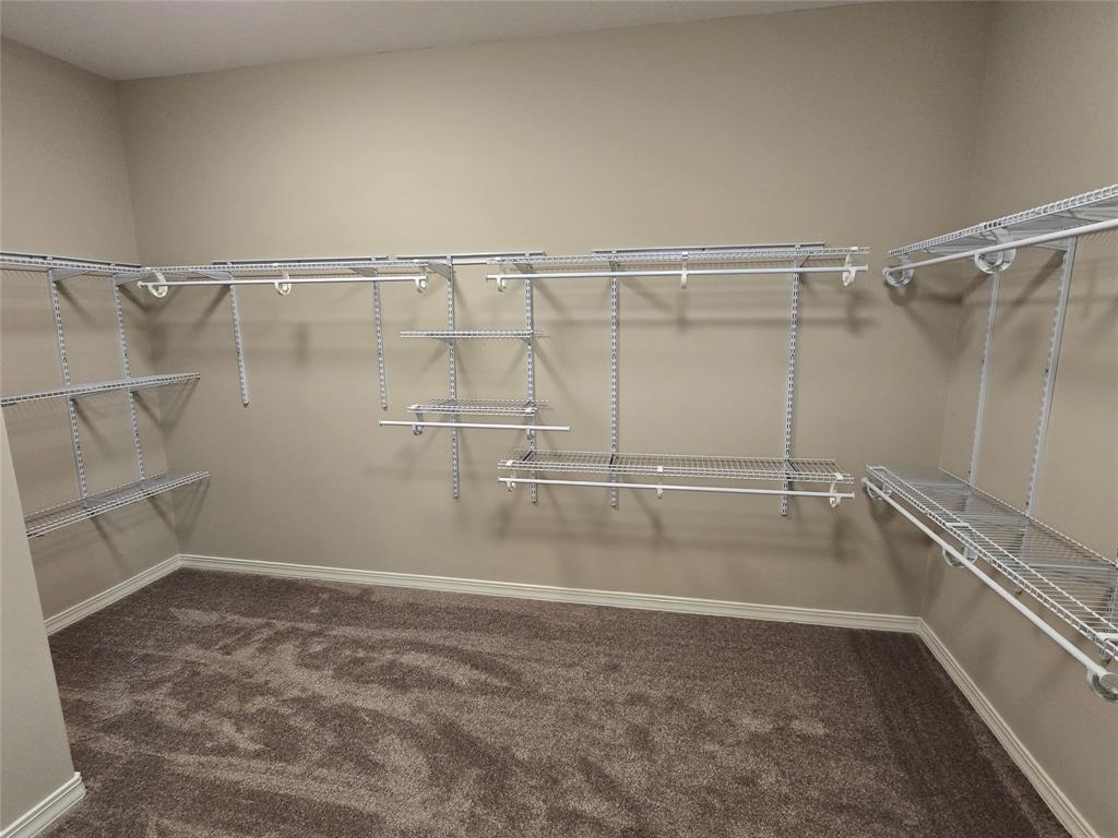 10407 Bethany State Line Road Bethany, LA 71007 - Photo 24 of 30 a view of a room with racks on the wall