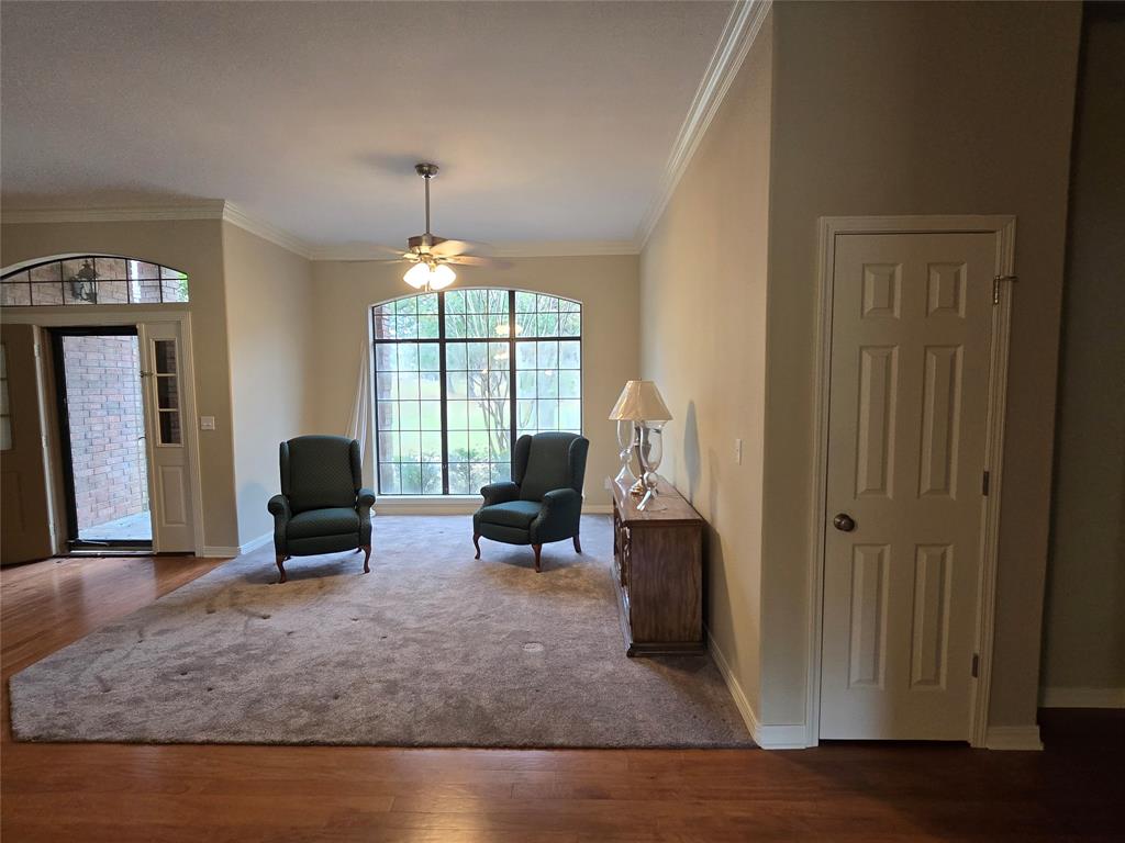 10407 Bethany State Line Road Bethany, LA 71007 - Photo 4 of 30 a living room with furniture a window and a chandelier
