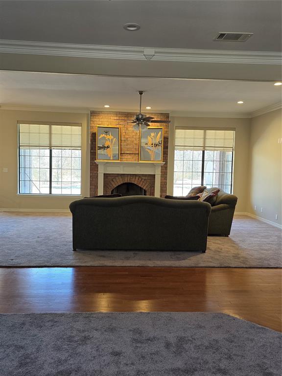 10407 Bethany State Line Road Bethany, LA 71007 - Photo 5 of 30 a living room with furniture and a fireplace