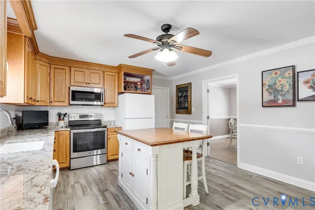 a spacious bedroom with a bed and a chandelier