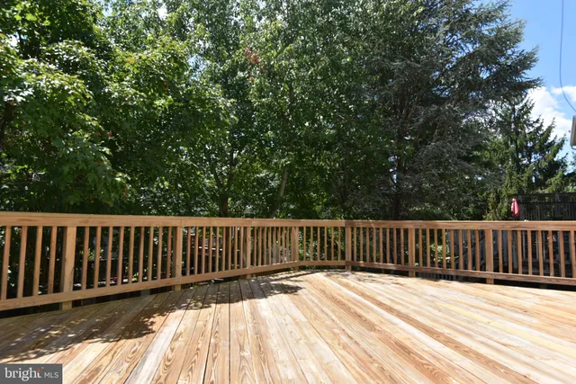 a view of deck with wooden floor and fence