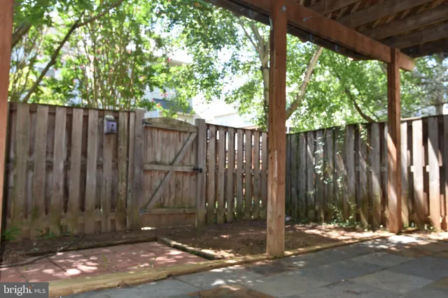 a view of outdoor space with wooden fence
