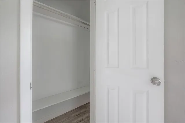 a bathroom with a bathtub and a ceiling fan