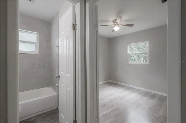 a bathroom with a sink toilet and bathtub