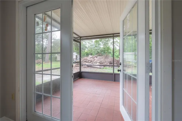 a view of empty room with windows and walls