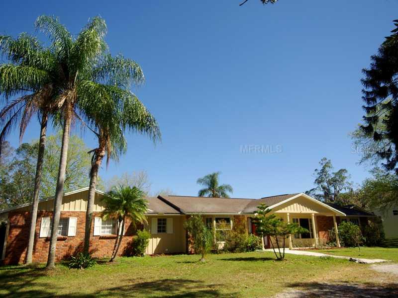 5811 Vanderipe Road Sarasota, FL 34241 - Photo 1 of 1 Exterior Front - The home has a circular driveway. The 2-car garage is on the left side; it has its opening on the side.