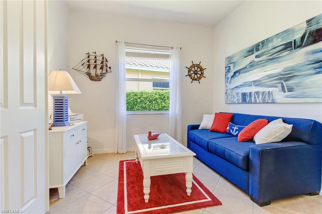 9258 Springview Loop Estero, FL 33928 - Photo 13 of 35 a living room with furniture and a window