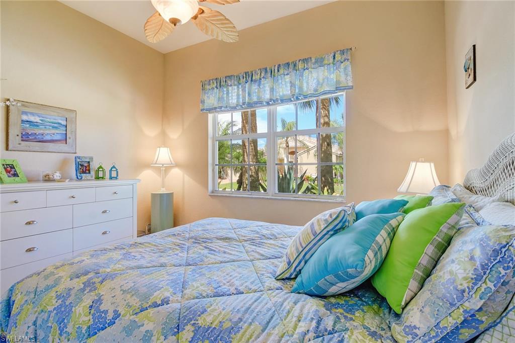 9258 Springview Loop Estero, FL 33928 - Photo 17 of 35 a bedroom with a bed and a window