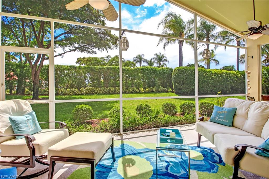 9258 Springview Loop Estero, FL 33928 - Photo 19 of 35 a view of a patio with couches chairs dining table and chairs