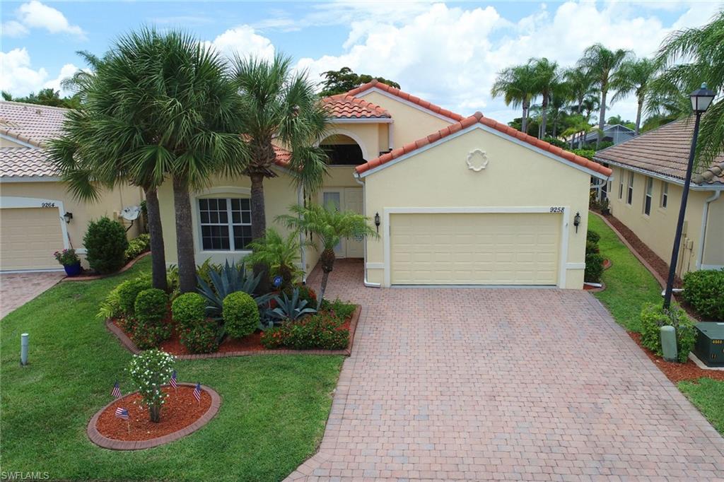 9258 Springview Loop Estero, FL 33928 - Photo 33 of 35 a front view of house with yard and green space
