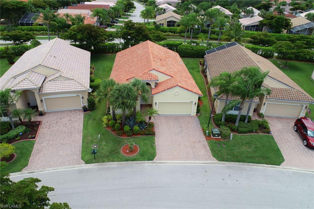 9258 Springview Loop Estero, FL 33928 - Photo 35 of 35 a view of multiple houses with a yard and plants