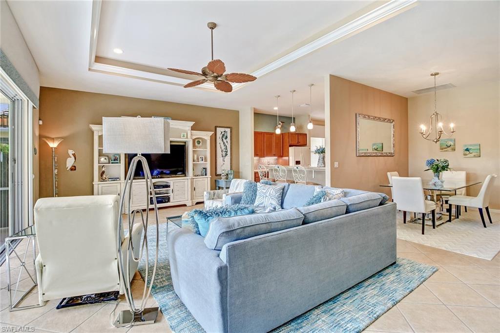 9258 Springview Loop Estero, FL 33928 - Photo 6 of 35 a living room with furniture and a view of kitchen