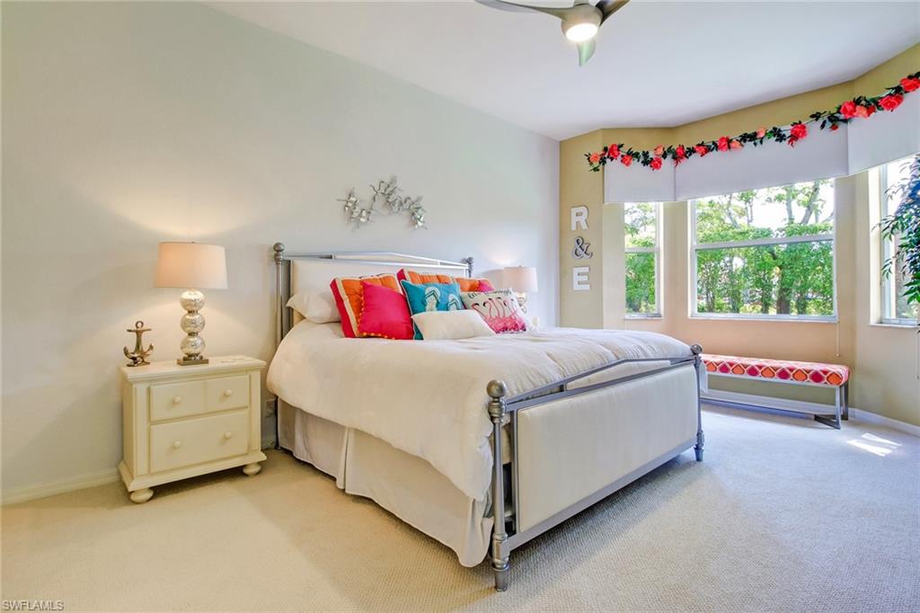 9258 Springview Loop Estero, FL 33928 - Photo 10 of 35 a bedroom with bed and a large window