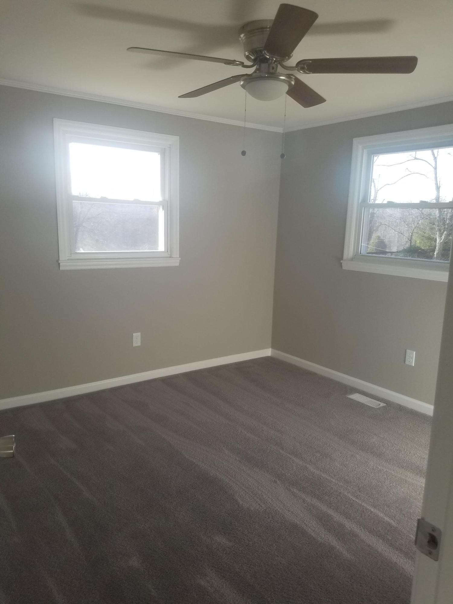 1415 Hardy Road Hardy, VA 24101 - Photo 14 of 20 an empty room with a window and a fan