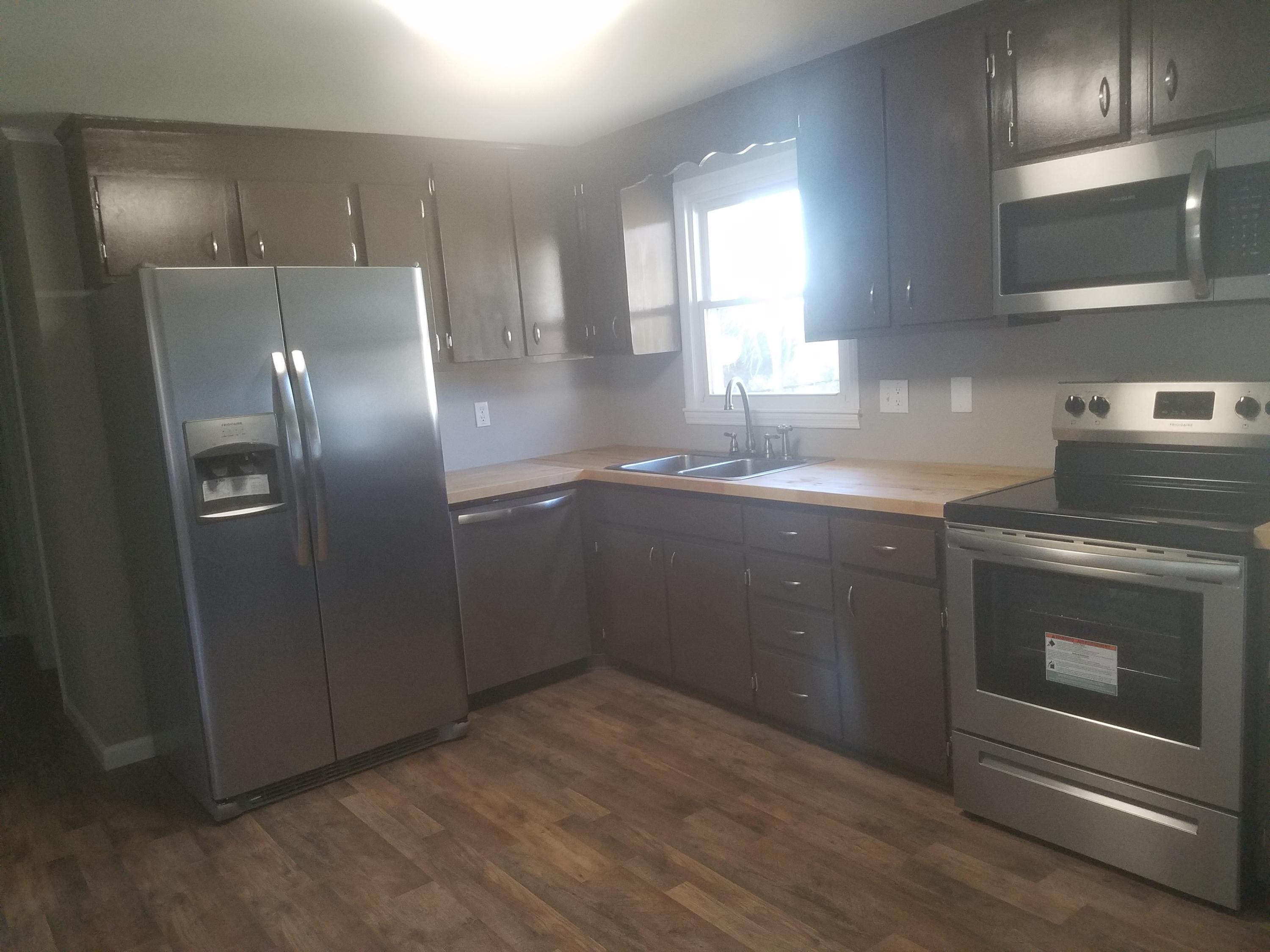 1415 Hardy Road Hardy, VA 24101 - Photo 5 of 20 a kitchen with stainless steel appliances granite countertop a sink a stove a refrigerator and island