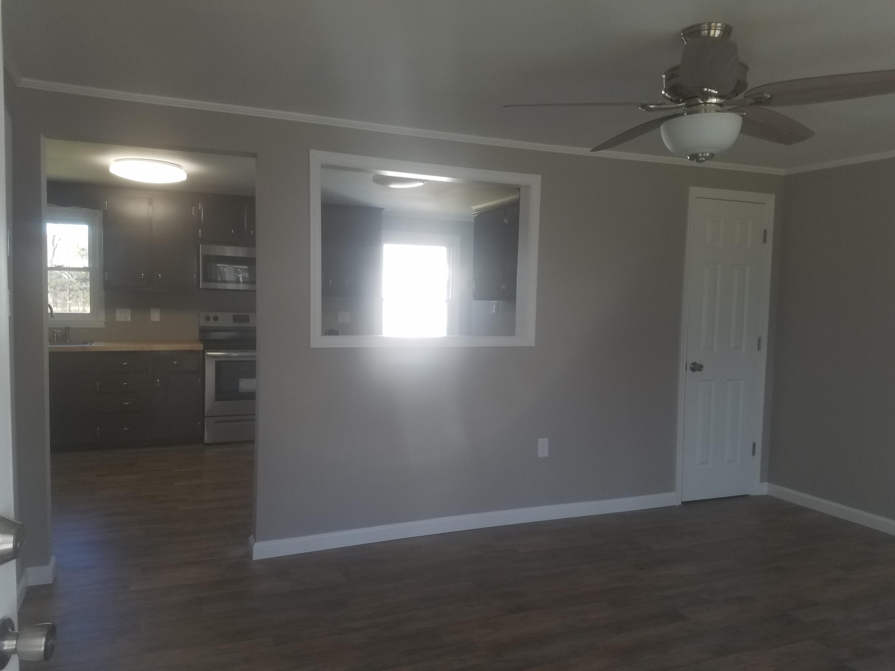 1415 Hardy Road Hardy, VA 24101 - Photo 7 of 20 an empty room with wooden floor and windows