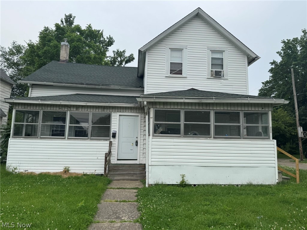 674-676 Carlysle Street Akron, OH 44310 - Photo 1 of 20 Two-story residence featuring white vinyl siding and a dark green shingle roof