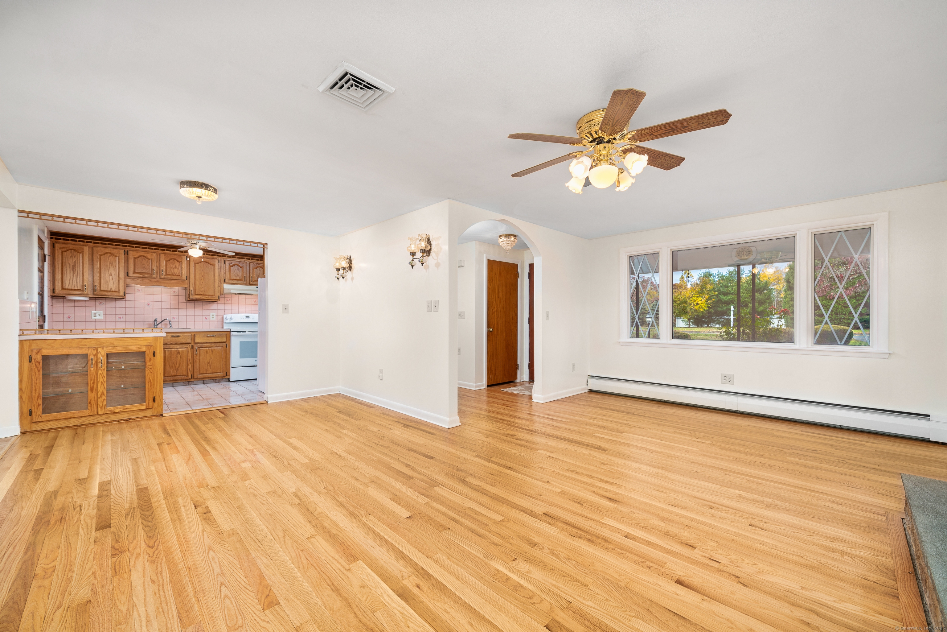 110 Coles Road Cromwell, CT 06416 - Photo 11 of 40 a view of an empty room with window and wooden floor
