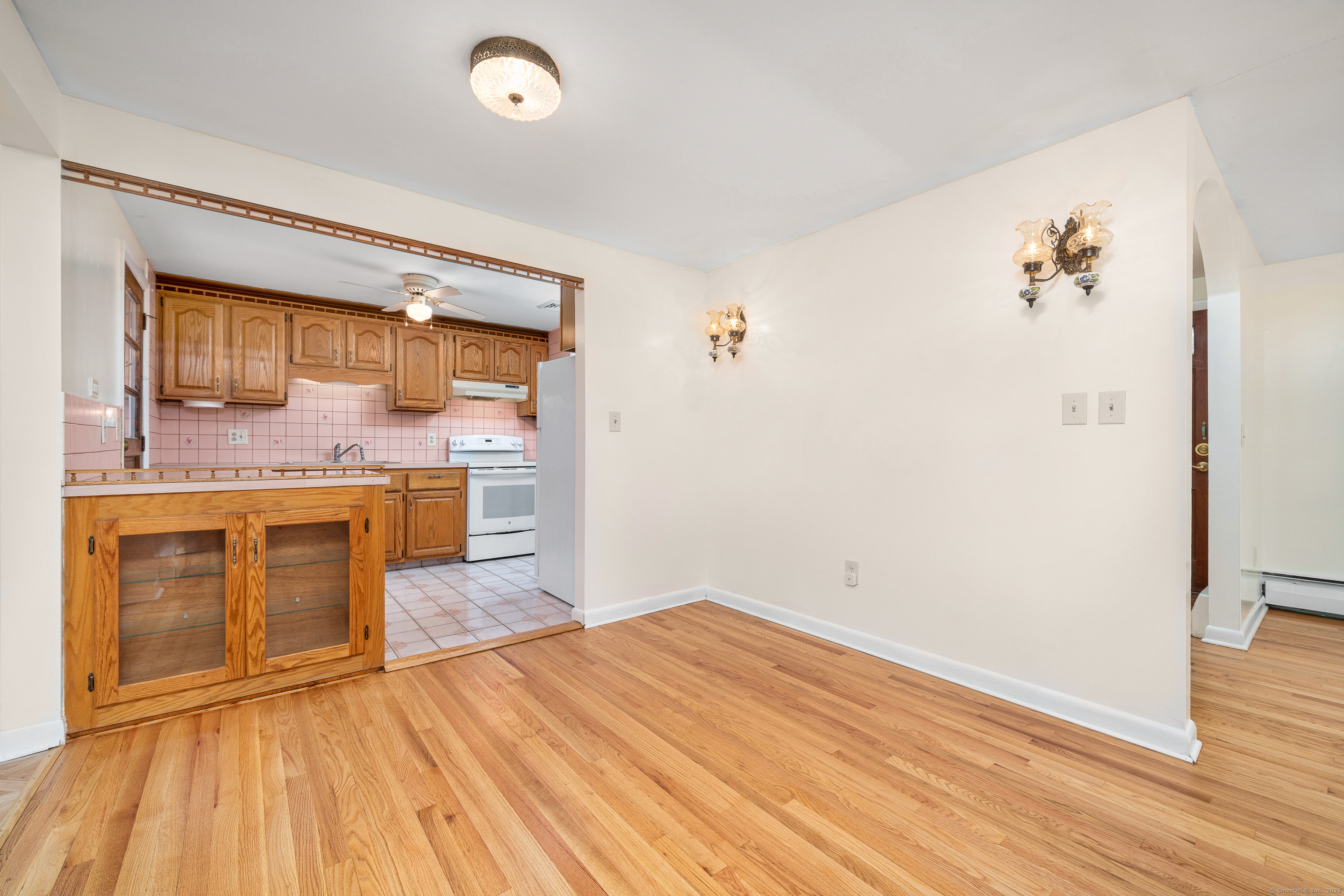 110 Coles Road Cromwell, CT 06416 - Photo 12 of 40 a kitchen with a sink cabinets and wooden floor