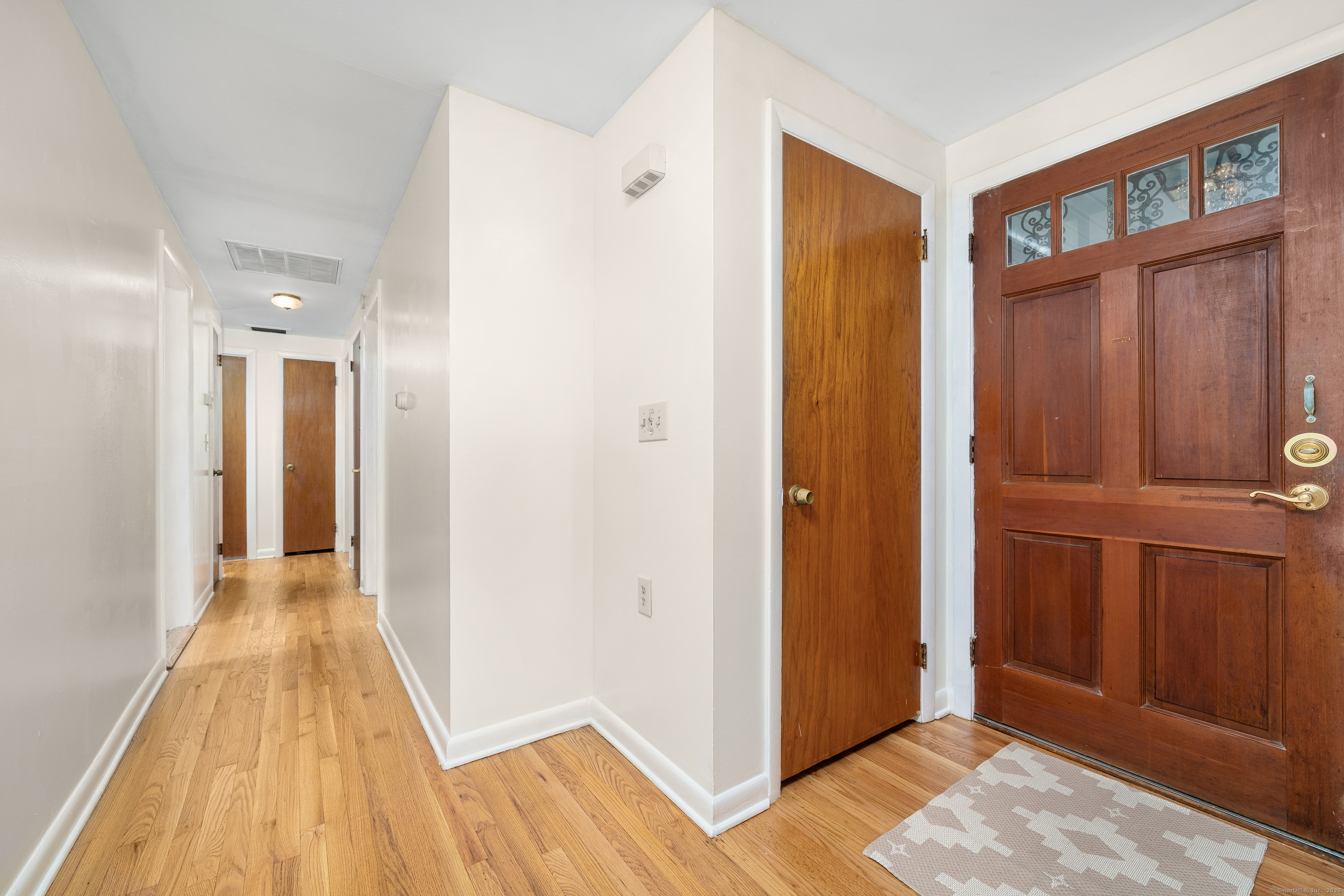 110 Coles Road Cromwell, CT 06416 - Photo 25 of 40 a view of a hallway with wooden floor and closet