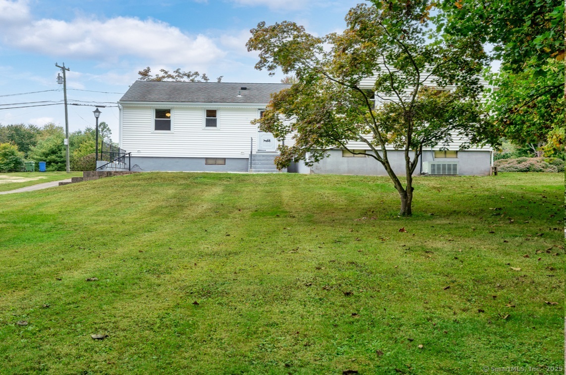 110 Coles Road Cromwell, CT 06416 - Photo 38 of 40 a view of a backyard with plants and large trees