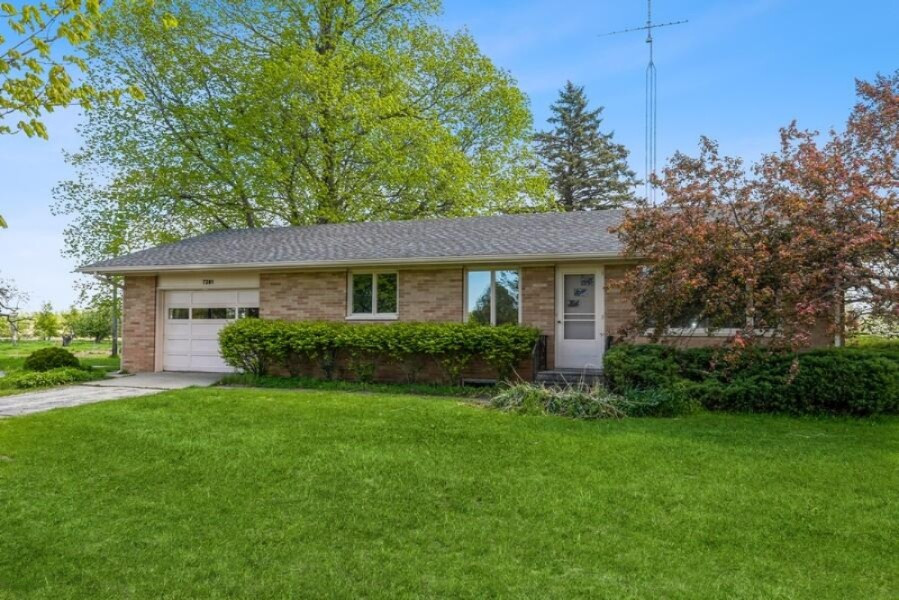 7281 Hillandale Road Sodus, MI 49126 - Photo 1 of 14 01_7281HillandaleRoad_57_FrontView_LowRe