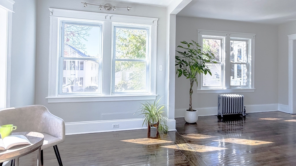4 Longfellow Road Worcester, MA 01602 - Photo 11 of 36 a living room with wooden floor and a window