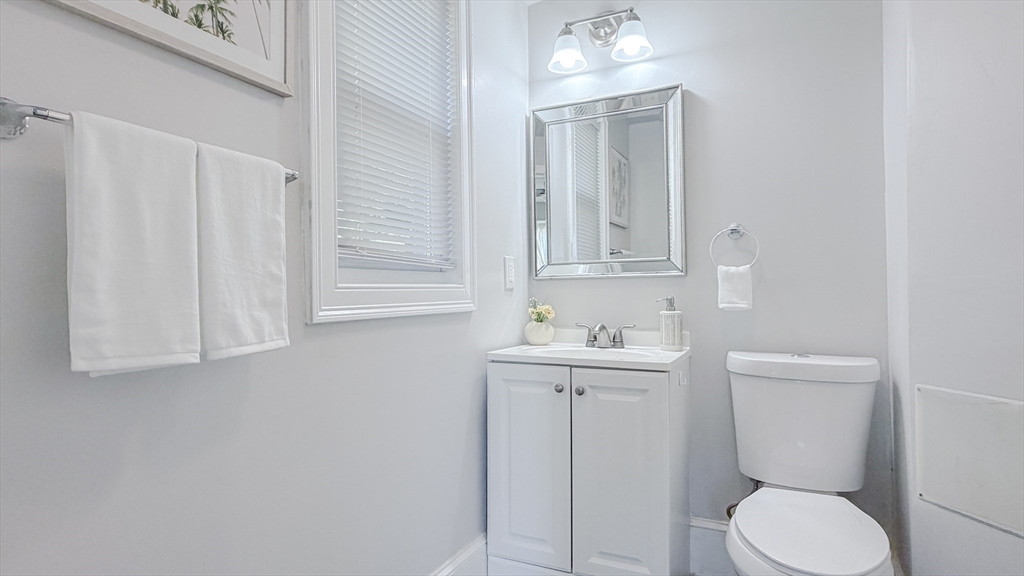 4 Longfellow Road Worcester, MA 01602 - Photo 17 of 36 a bathroom with a toilet a sink and mirror