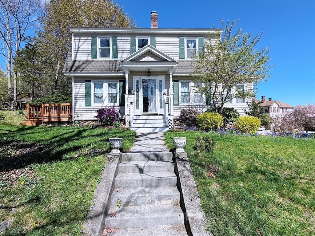 4 Longfellow Road Worcester, MA 01602 - Photo 2 of 36 a front view of a house with a yard table and chairs
