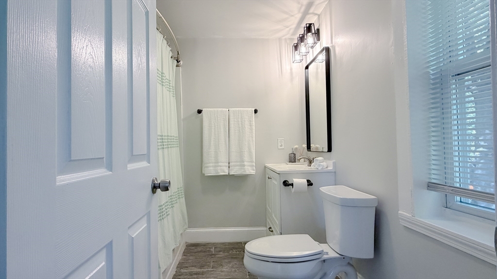 4 Longfellow Road Worcester, MA 01602 - Photo 25 of 36 a bathroom with a toilet a sink and shower