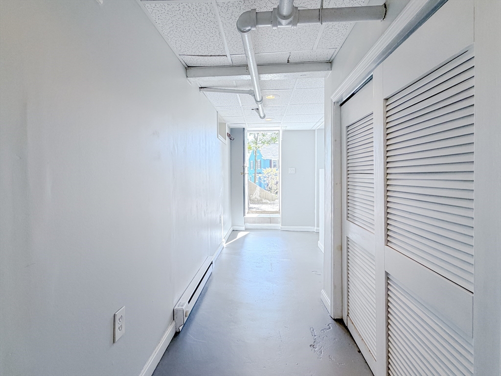 4 Longfellow Road Worcester, MA 01602 - Photo 29 of 36 a view of hallway with windows and chandelier