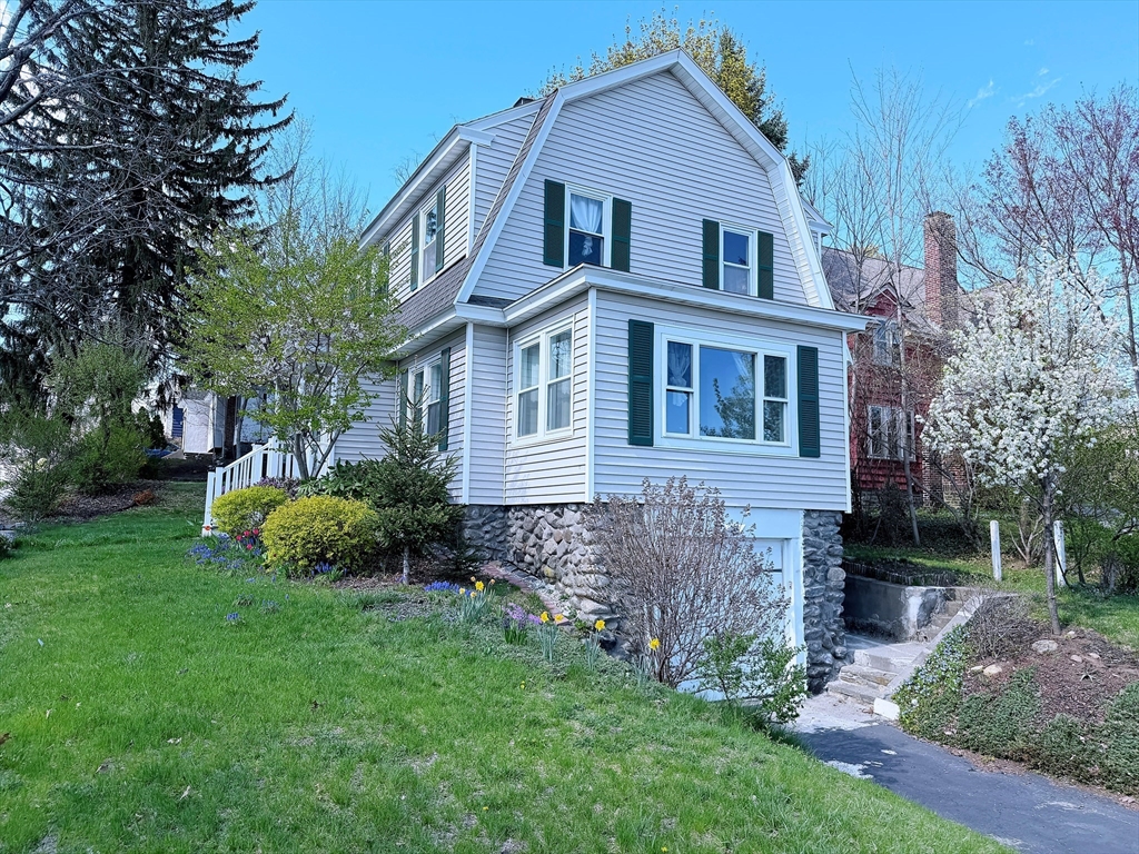 4 Longfellow Road Worcester, MA 01602 - Photo 30 of 36 a front view of a house with a garden